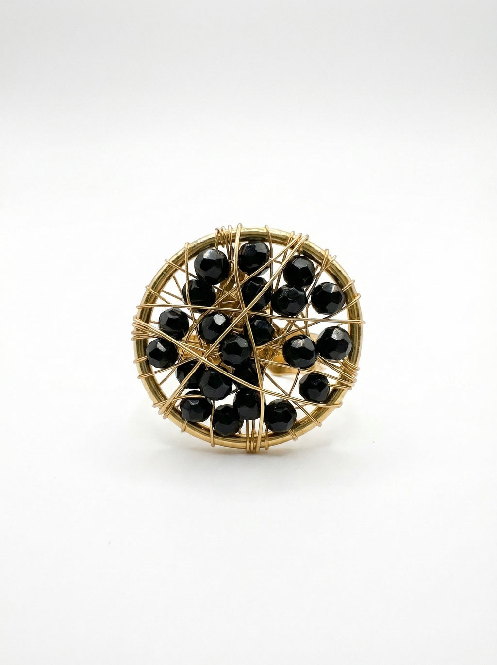 gold ring with black crystals