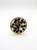 gold ring with black crystals