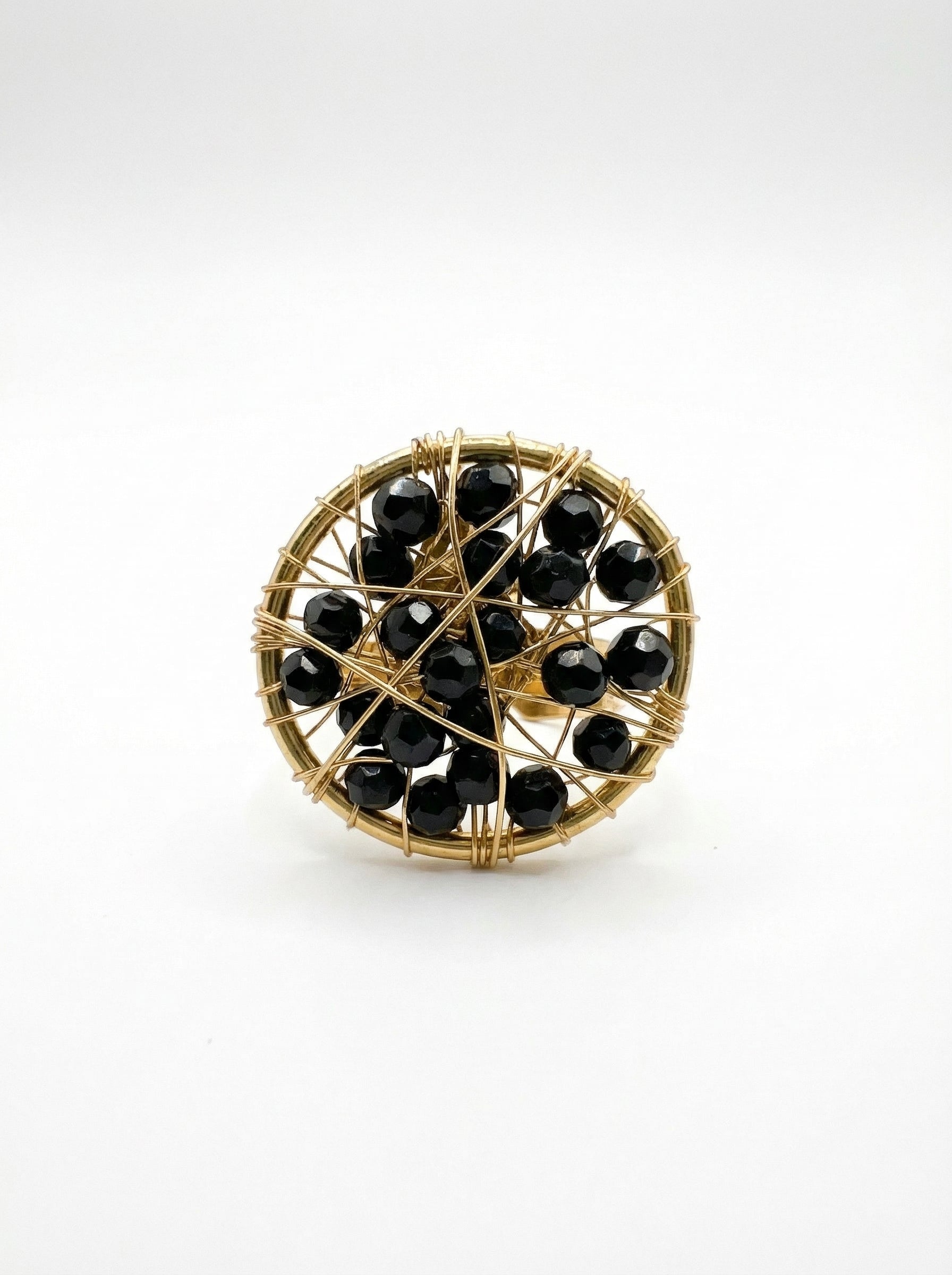 gold ring with black crystals