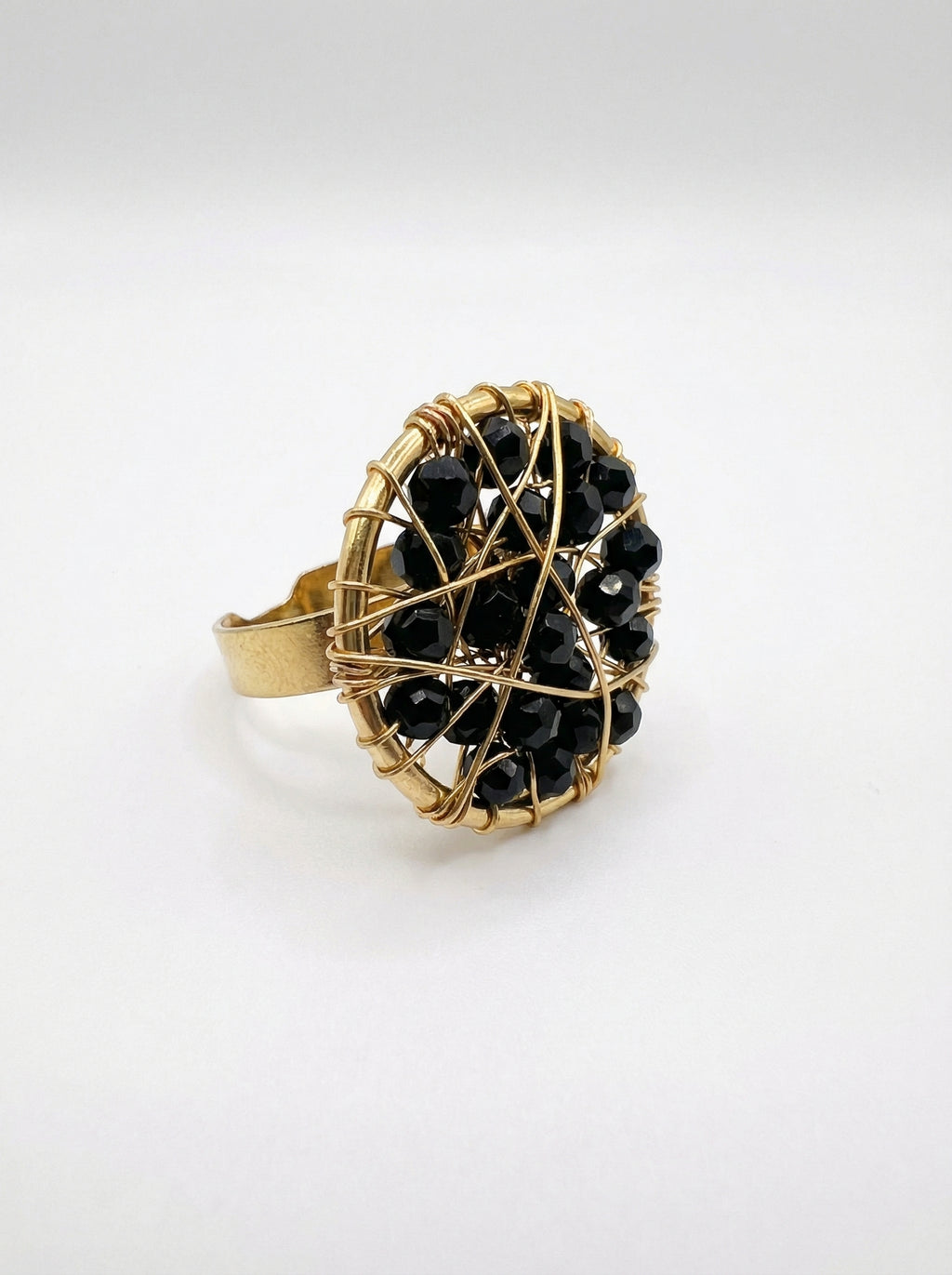 gold ring with black crystals