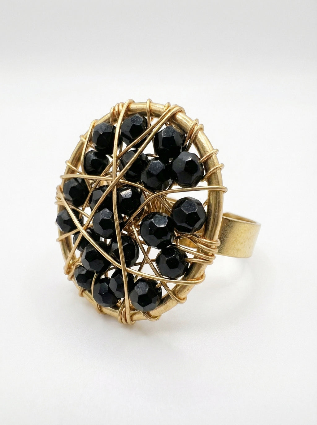 gold ring with black crystals