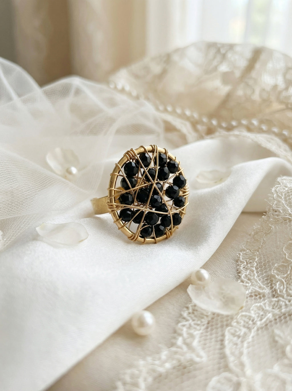 gold ring with black crystals